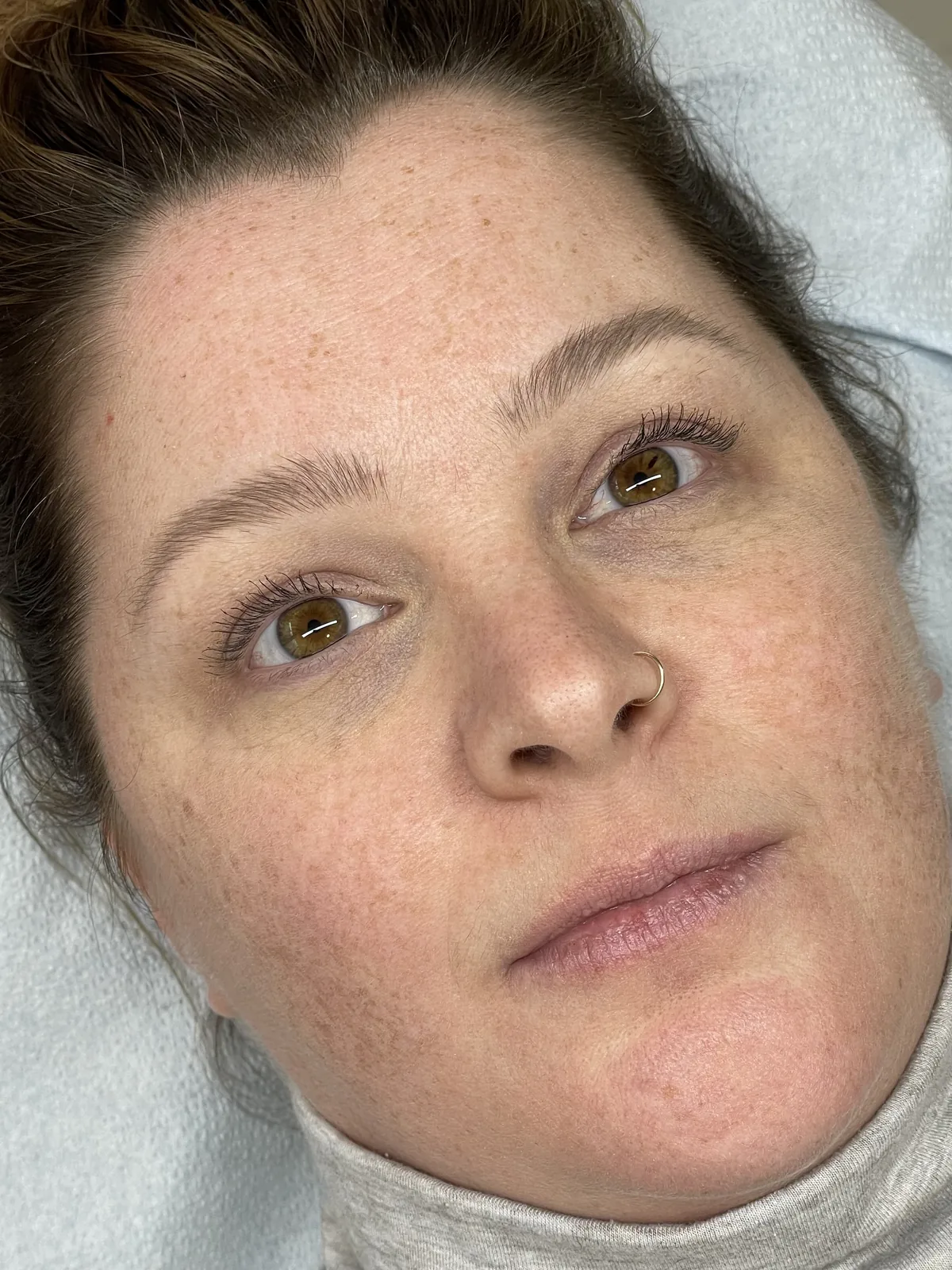 Healed microblading on both brows, soft natural shape framing the face